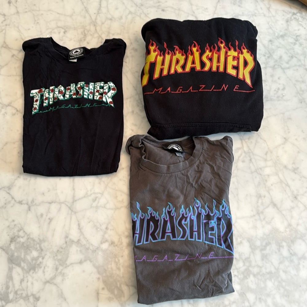Group of three thrasher shirts/hoodie. Can sell separately. Sizes in pics. New